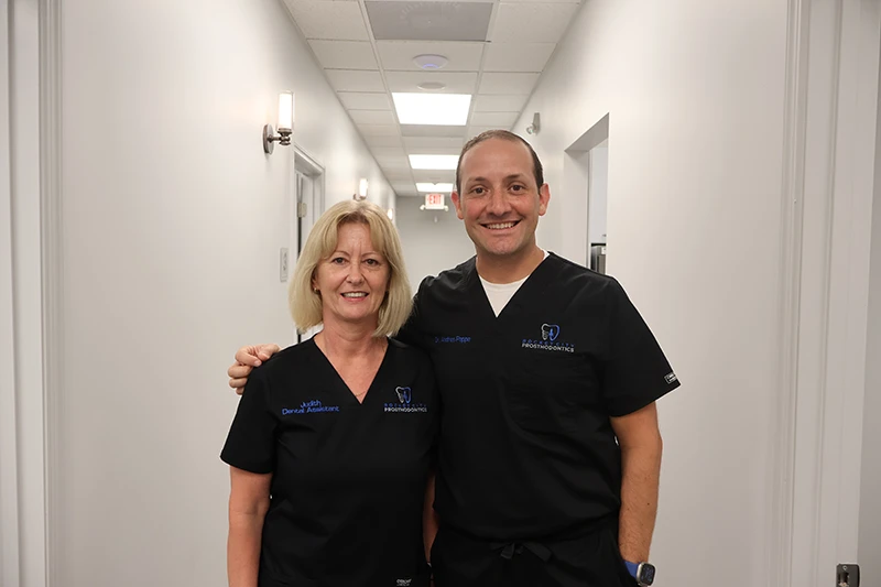 Dr. Pappa and his assistant at Rocket City Prosthodontics.