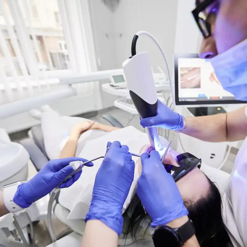 A dentist using an intraoral scanner